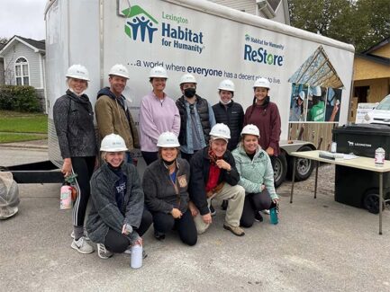 Group photo of Hanna Resource Group team members at a Habitat for Humanity home building project.
