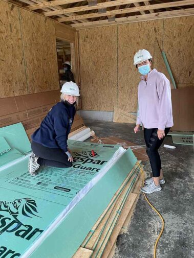 Photo of Hanna Resource Group team members volunteering at a Habitat for Humanity home building project