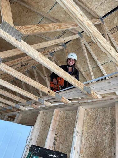 Photo of Hanna Resource Group team member, Candra Bryant, volunteering at a Habitat for Humanity home building project.