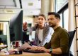 Photo of Woman in HR Helping a Teammate