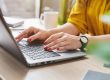 Photo of an HR professional typing a job description