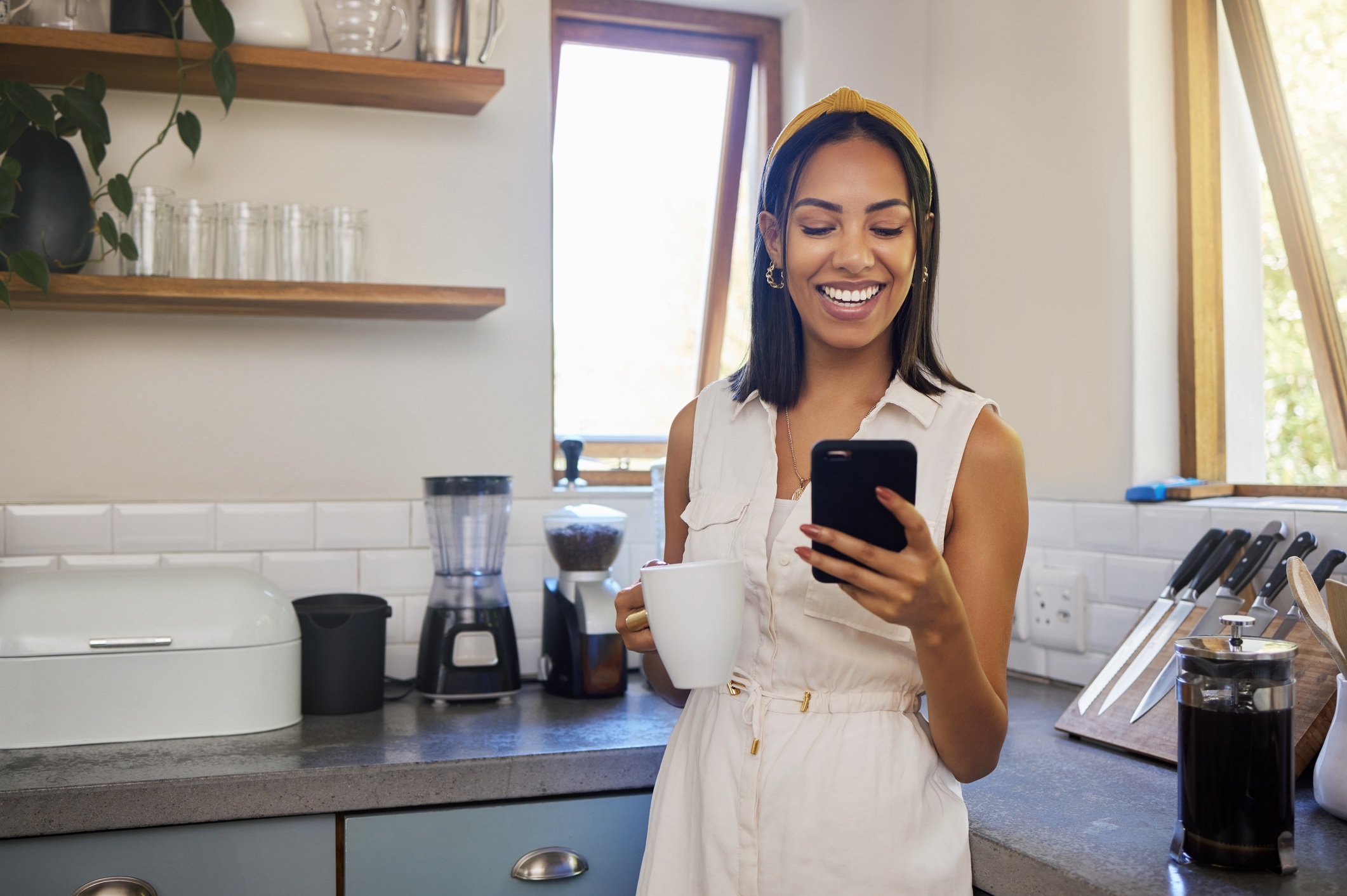Work from Home Employee Smiling at Phone Photo of a Work from Home Employee Smiling at Phone